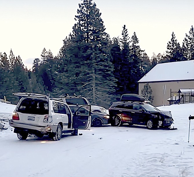 A screenshot of video of cars sliding into a collision at Tramway and Jack on Wednesday.