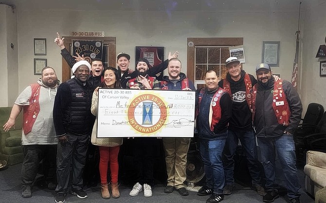 The 20/30 men’s club approved its annual sponsorship for the Molly Scholarships.  Front row are MEFIYI's JoJo Townsell and Viviana Zumstein. In back, from left, are Tim Provost, Timber Eric Jacobs, Wolff Robbie Boulais,  Sunshine Jake Beaudreau, Crash Max Whear, Ol Lippy Cody Burkhauser, Brickhouse Kory Swift, Scooter Aaron Meeden and Uggs.