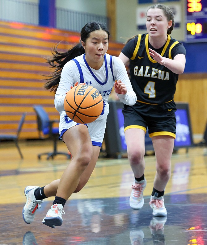 Dahlia Keating dribbles past a Galena defender Saturday in a 50-46 overtime loss against the Grizzlies. Keating led the Senators in scoring with 14 points.