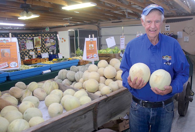 Cantaloupe grower Rick Lattin shows his crop of melons before the annual Fallon Cantaloupe Festival began in August.