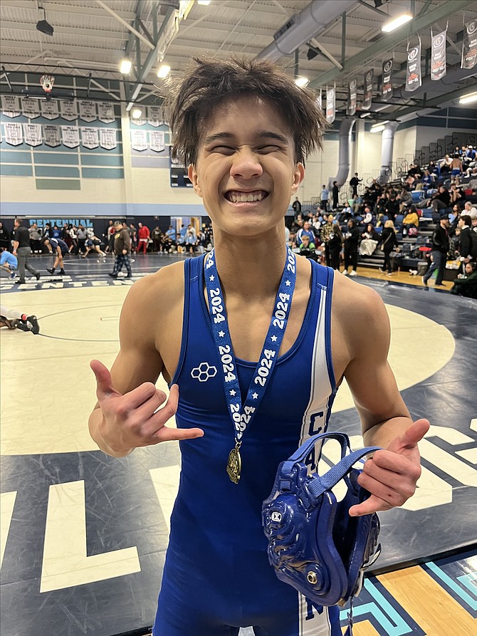Keona Basa grins ear-to-ear after winning his 120-pound weight bracket at the Centennial Bulldog Grappler in Las Vegas this past weekend. Basa went 4-0 as an individual, winning his final match by 5-3 decision.