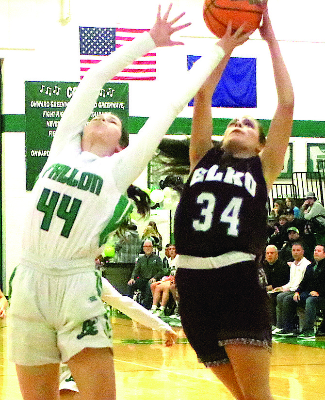 Elko’s Jessica Vera (34) goes up for a basket as Fallon’s Raegan Johnson tries to block the shot.