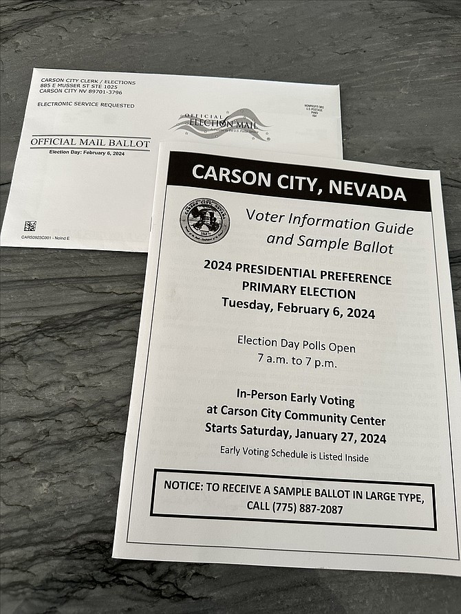 Photo by Adam Trumble showing a sample ballot and a mail-in ballot.