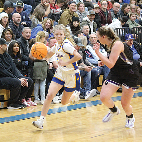 Lowry’s Natalee Formby drives to the basket against Spring Creek.