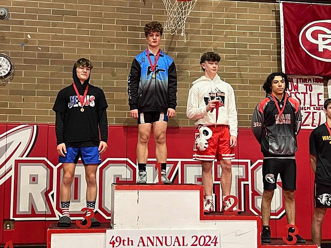 Eatonville’s Jacob Ostendorf stands atop the podium after claiming first place in the 157-pound class at the Jim Bair Invitational wrestling tournament.