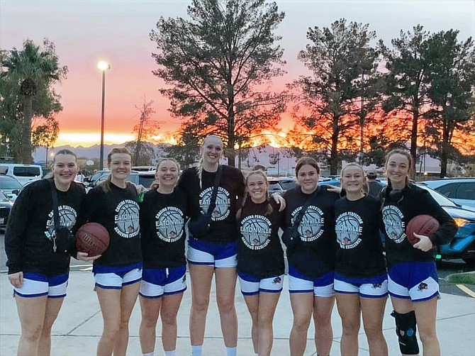 The Eatonville girls basketball team poses for a team photo at sunset while in Arizona participating in the Coyote Basketball Invitational.