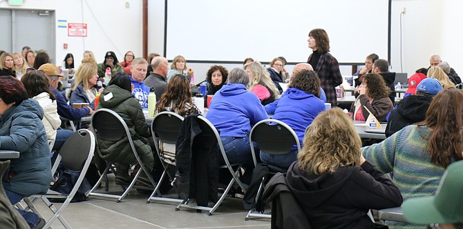 Carson City risk manager Ann Cyr, standing, listens to feedback from Carson City School District administrators after a reunification drill at Monday’s training at Fuji Hall.