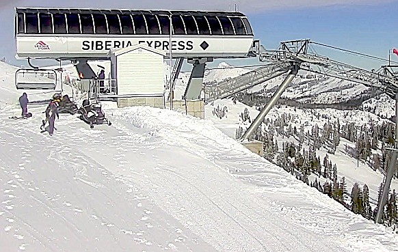 Workers at one of the lifts at Palisades Tahoe.