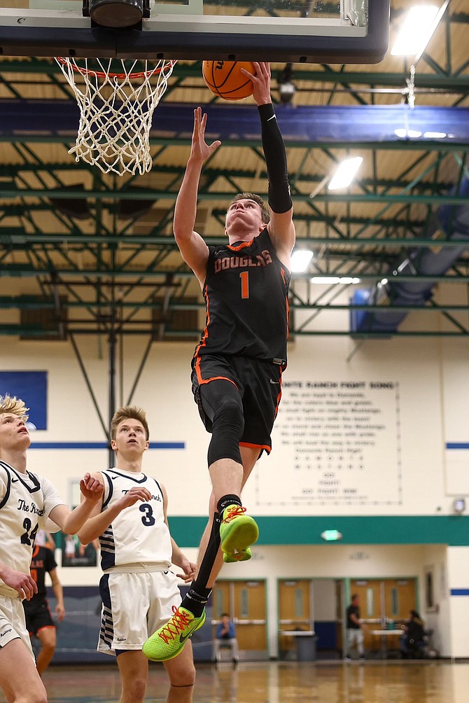 Douglas High’s Jett Lehmann goes up for two of his 22 points against Damonte Ranch on Tuesday night. Lehmann and the Tigers fell to the Mustangs, 65-54.