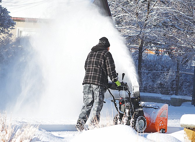 Snowblowers were operating across Carson Valley on Thursday morning after snow fell overnight.