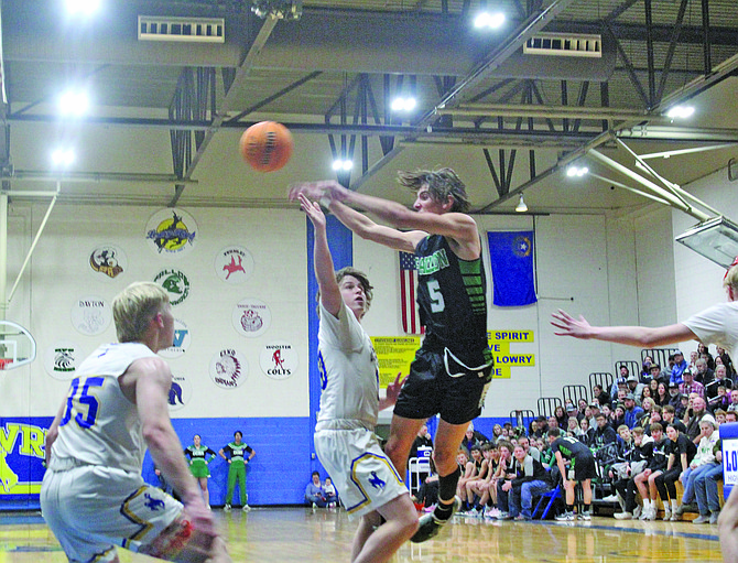 Fallon's Brady Alves passes from the baseline in the Greenwave’s win over Lowry on Friday.