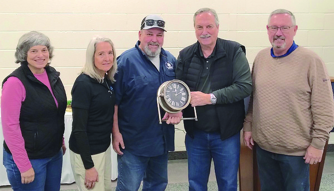 Kevin Gulley receives a clock commemorating his years of service to the City of Fallon. From left are Councilwomen Kelly Frost and Karla Kent, Gulley, Mayor Ken Tedford and Councilman Paul Harmon.