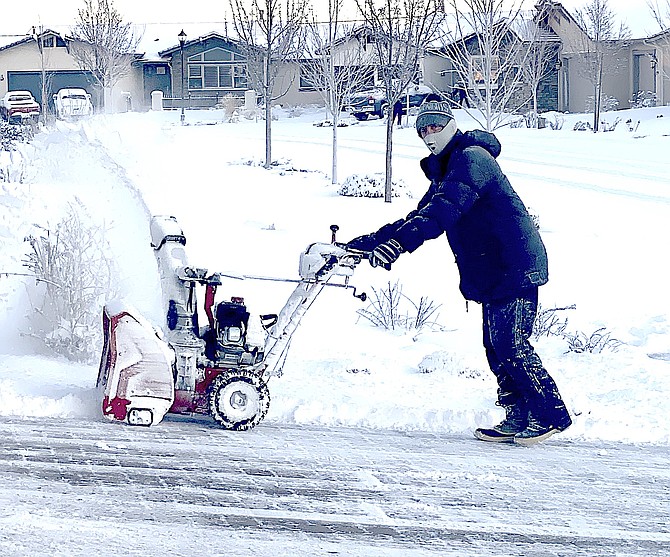 Paul Andrew plows sidewalks in his Minden neighborhood. Photo special to The R-C by Robin Sarantos