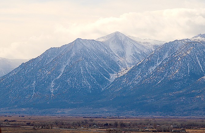 Jobs Peak rises above Carson Valley around lunchtime on Saturday as another storm blows through without leaving much moisture.