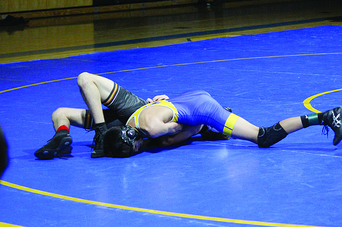 Lowry’s Kruz Gomez pins Fernley’s Manny Montano during duals in Winnemucca on Jan. 17.