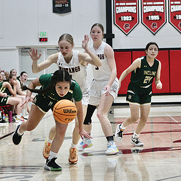 Taylor Garland and Raegan Burrows defend against Incline at PCHS last Saturday afternoon.