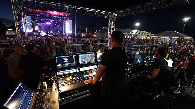 Lighting designer David Perez and Starsound Audio President Nick Sorrentino operate control panels at last year's War concert during Hot August Nights at the Grand Sierra Resort outdoor stage.