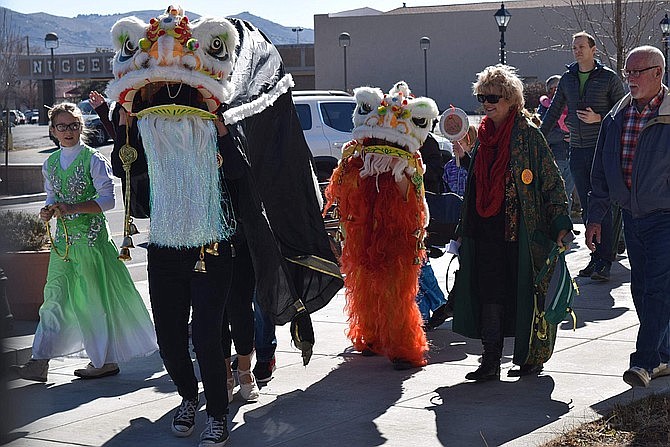 Lion Dancers lead the crowd out of the Dema Guinn Concourse at the Nevada State Museum during the 2018 Chinese New Year celebration.