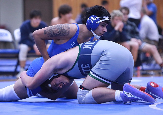 Carson High's Izaiah Oliva works atop his opponent from Damonte Ranch Tuesday. Oliva went 2-0 in the Senators' two duals with both wins coming by fall.