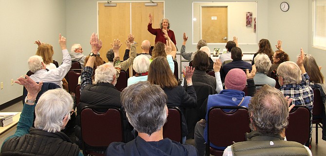 Local poet Kathy Nelson asks the audience a question during a poetry reading at the Carson City Senior Center on Jan. 30.