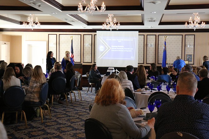 Nicole Reilly, ombudsman for the Committee on Domestic Violence of the Nevada Office of the Attorney General, left, is introduced by Xquisite Executive Director Brenda Sandquist during her opening remarks for National Human Trafficking Prevention Day in the Nevada Room at the Governor’s Mansion on Jan. 25.