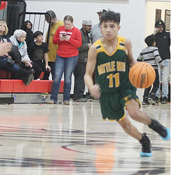 PEGGY JONES • Great Basin Sun
Battle Mountain's Geovanni Ruvalcaba dribbles to the basket during Friday's game against Pershing County in Lovelock.