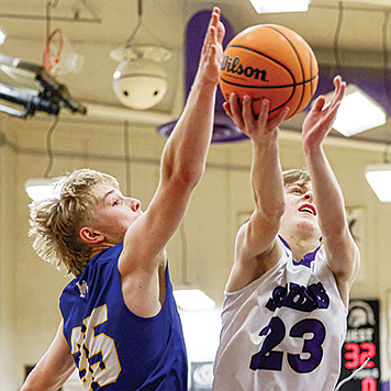 ANTHONY MORI • Elko Daily Free Press
Lowry's Dempsey Jenkins attempts to block a shot in Thursday's game at Spring Creek.