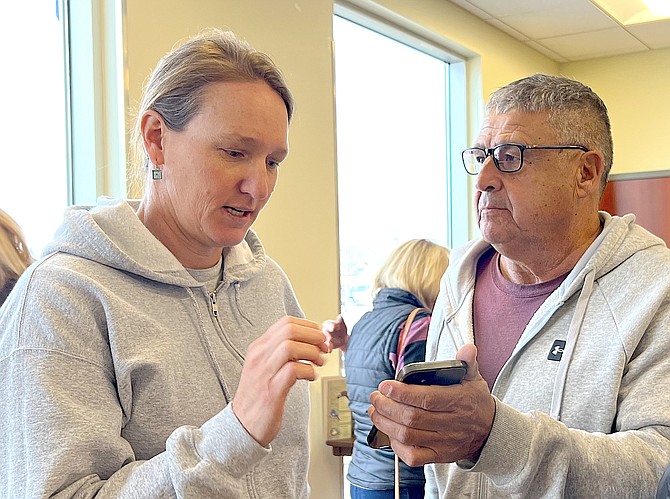 University of Nevada Cooperative Extension's Jessica Gardner helps a resident identify a plant at the Seed Swap on Saturday.