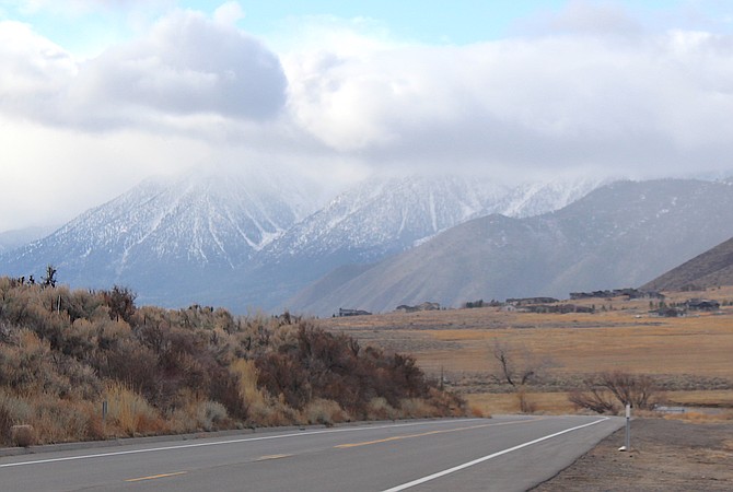 Clouds obscure the top of the Carson Range from Jacks Valley Road on Friday morning. It was sunny in parts of the Valley while flurries were falling in the northwest corner.