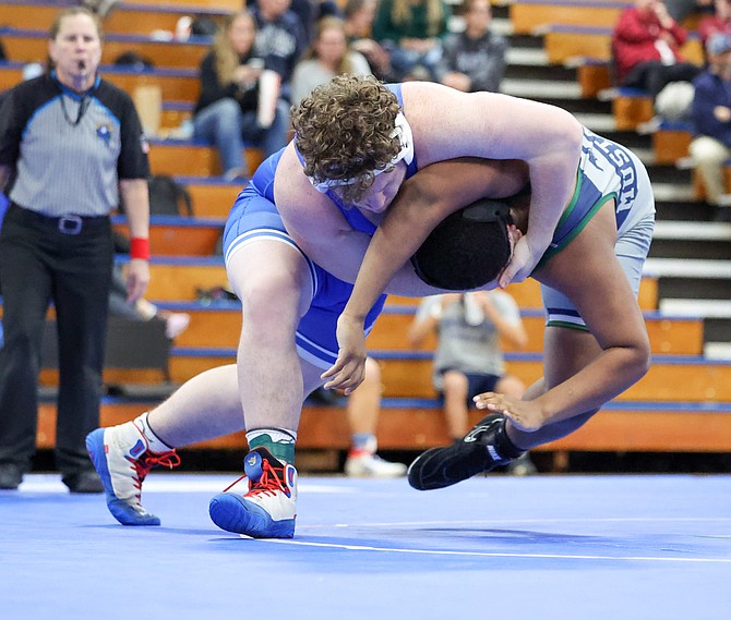 Carson High junior Dominic Porter secures a head and arm throw against his opponent from Damonte Ranch earlier this week. Porter has become one of the Senators’ premier wrestlers this season.