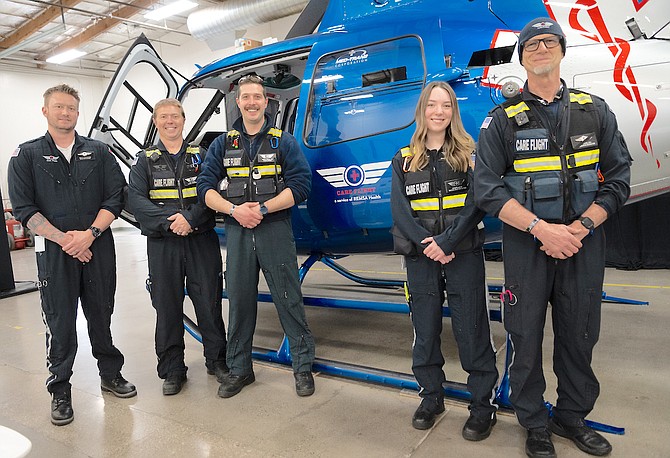 From left: Care Flight Paramedics Jake Beck and Zac Hogan, Flight Nurse Travis Weber, CCT Tech Reilly Isaacson and Air Communications Specialist William Hehn appear with the new Care Flight 1 helicopter during an event in Reno.