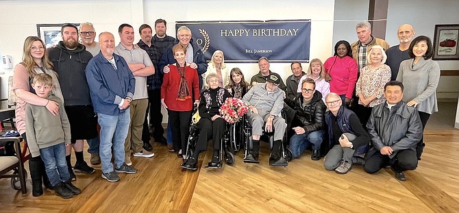 Friends and family of Bill Jameson gather around the World War II veteran at his 100th birthday party Feb. 4.