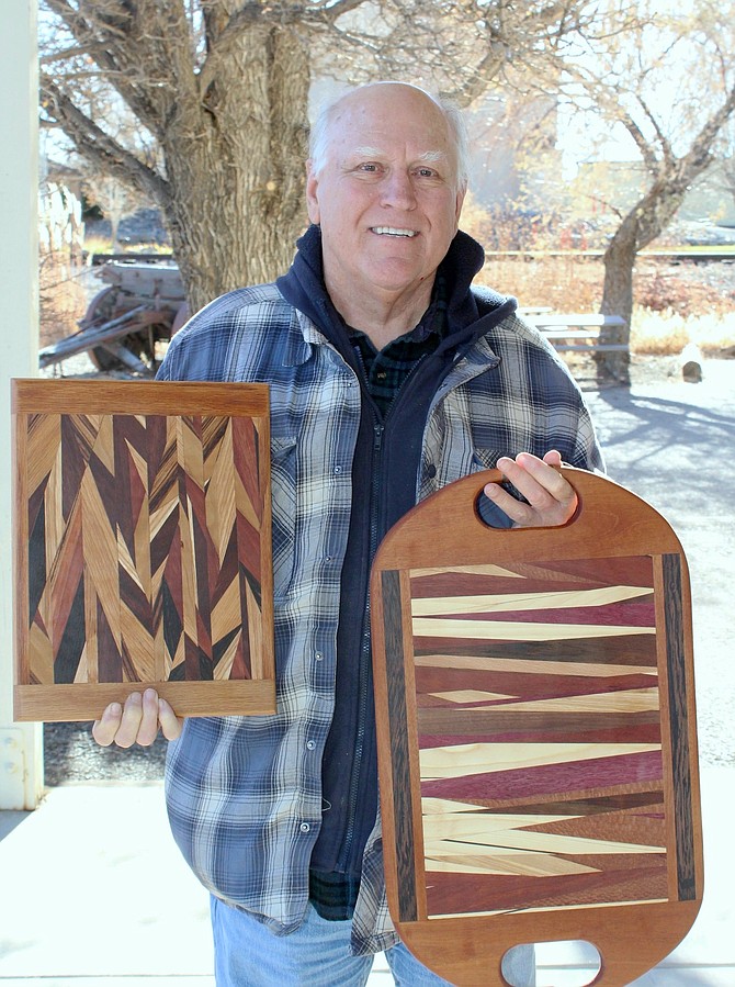 Travis Skaggs shows off his hand-crafted charcuterie boards.