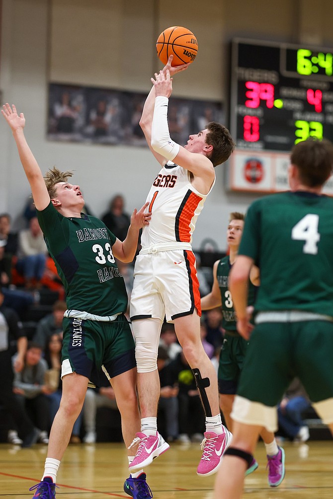 Douglas senior Jett Lehmann goes up for two against Damonte Ranch on Tuesday. Lehmann had a team-high 15 points in the loss.