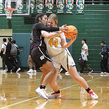 Battle Mountain's Paitynn Johns fights for space as she looks to dribble against West Wendover.