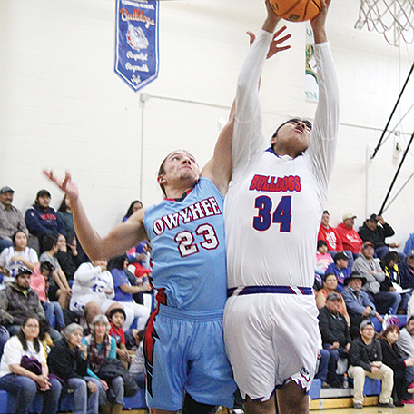 McDermitt’s Shandon Camas battles for a rebound during Friday’s game with Owyhee in McDermitt.