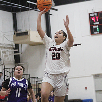 Pershing County senior Yasmine McKinney scores against Yerington at PCHS last Tuesday night.