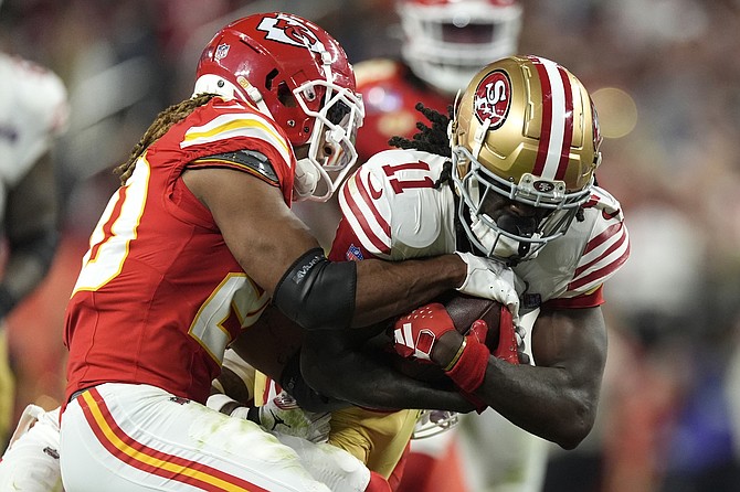 Chiefs safety Justin Reid (20) stops 49ers wide receiver Brandon Aiyuk (11) during the second half of the Super Bowl on Sunday.