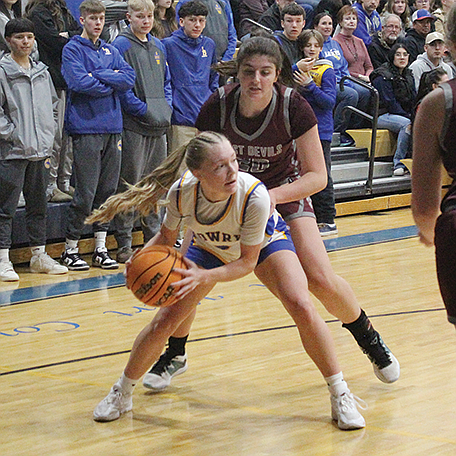 Lowry's Bryce Brinkerhoff looks to pass the ball to a teammate during Friday's game against Dayton.