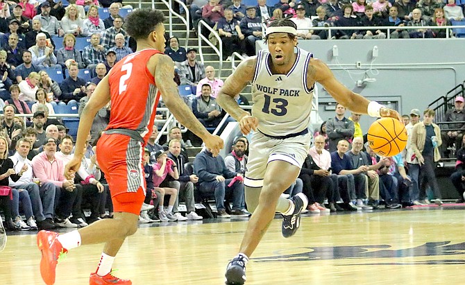 New Mexico’s Donovan Dent (2) looks to slow down Pack guard Kenan Blackshear (13) as he brings the ball downcourt. Nevada dropped an 83-82 thriller Tuesday night at Lawlor Events Center.