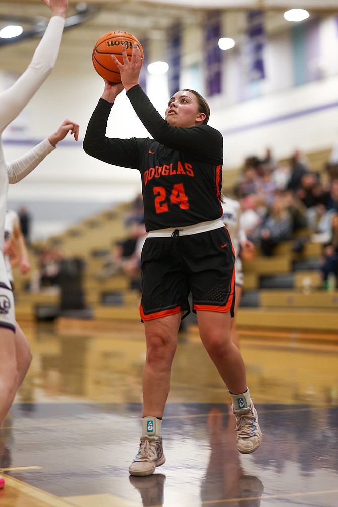 Douglas High senior Zora Simpson scores two of her team-high 11 points Thursday night at Spanish Springs, during the Class 4A North regional semifinal.