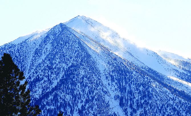 Snow dances in the wind on Jobs Peak just before a winter storm warning takes effect on Sunday.