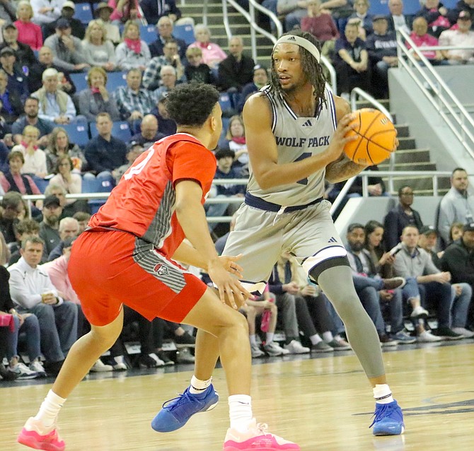 Nevada’s Tre Coleman, shown against New Mexico earlier this season, has helped the Wolf Pack to a 20-win season.
