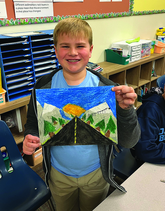 Tanner Tippett shows off an example of perspective in his artwork.