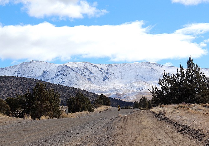 The Pine Nut Mountains received a dose of snow from Monday's storm and Pine Nut Creek is running, though compared to last year, just a little.