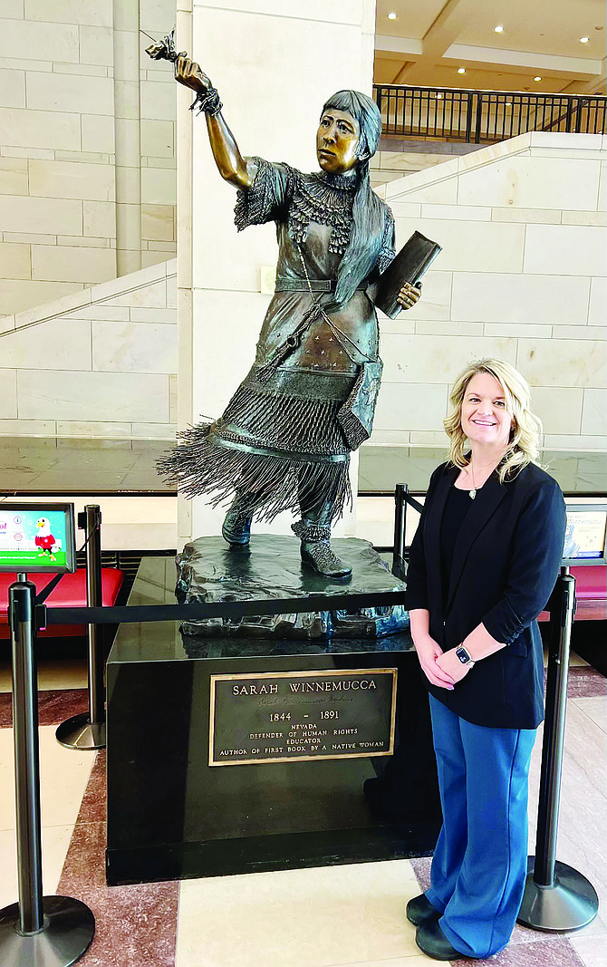 HGH CEO Robyn Dunckhorst poses by the Sarah Winnemucca statue in Washington D.C.