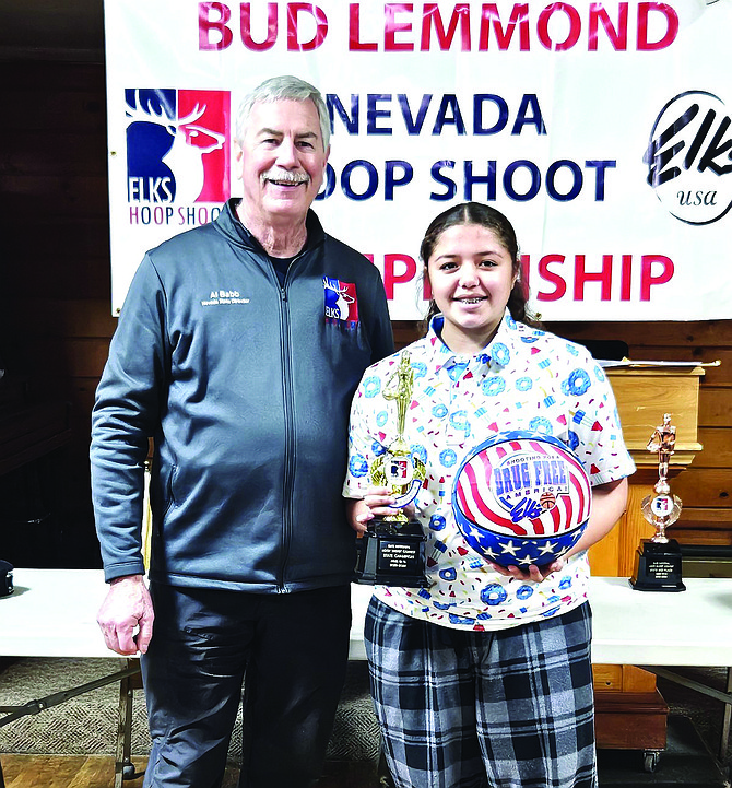 Al Babb, Nevada state director, left, stands with Amillya Bishop, the 12-13-year-old winner.