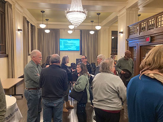 Half of the Snohomish town hall event held Nov. 17 in the Carnegie Building was to chat and gather. Standing at left is Brian Mills, the current chair of the city’s public safety commission.