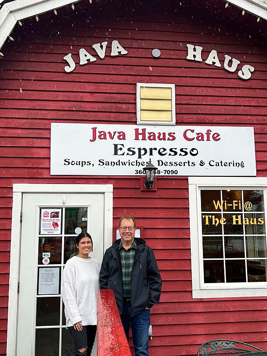 Java Haus’s new owner Kobi Gomez and exiting owner James White stand outside its front door Sunday, April 9.