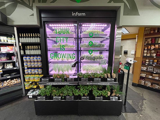 Infarm’s produce kiosk inside the QFC grocery at 22833 Bothell-Everett Highway. Since the product is still alive, it won’t wilt, which should reduce food waste at stores.